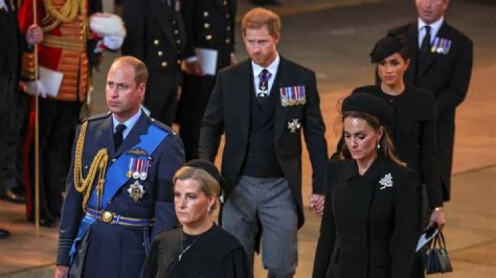 
Prince Harry, Meghan Markle Hold Hands, Exit Queen Elizabeth’s Service Behind Prince William, Kate Middleton 