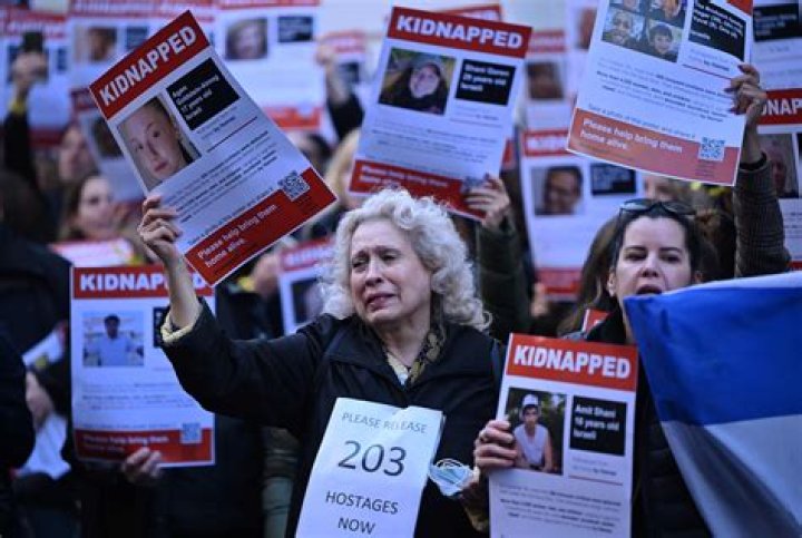 Who is Dana Baraket? Woman apprehended tearing posters of Israeli children missing in Hamas custody, along with her sister Aya Baraket in Upper West Side NYC. - SarkariResult